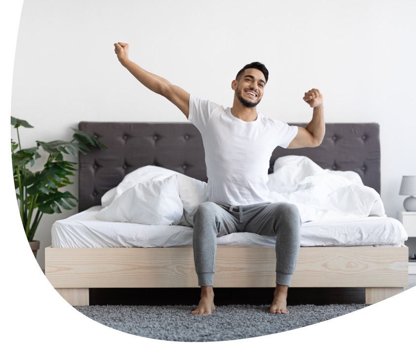 man siting on a bed